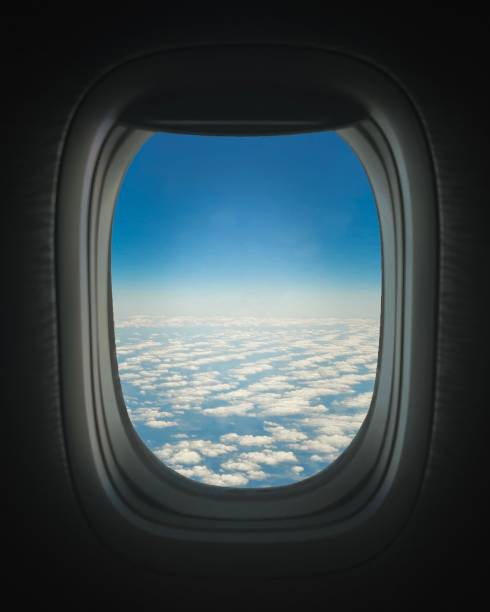 istock Vertical shot of a blue sky view with clouds from an airplane window 1433568283