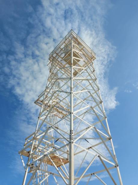 istock Low angle shot of a steel tower with a cloudy blue sky background 1433571027