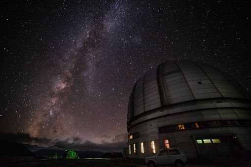 Frederick C. Gillett Gemini North telescope open for evening viewing just as stars begin to emerge in sky on the summit of Mauna Kea. Hawaii, USA.