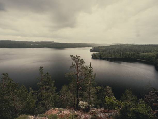 A stunning lake view from a high rock on a gloomy day