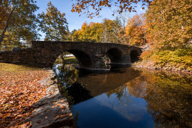 istock Stone Arch Bridge in Callicoon, NY, Catskill Mountains, surrounded by brilliant fall foliage on a bright autumn morning 1433574604