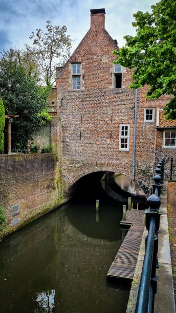 istock Canal with reflections and city buildings 1433575281