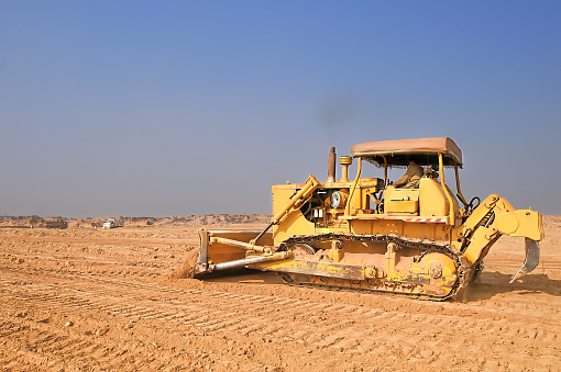A bulldozer on work earthmoving, soil removing, earth working