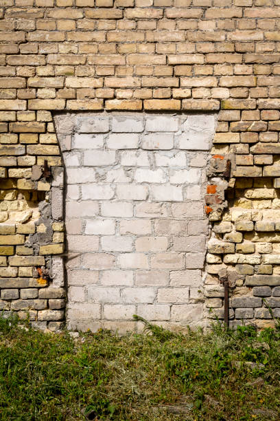 istock Old abandoned wall with bricked up windows 1433582928