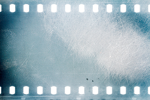 Close up of the end of a 35mm color negative photographic film, with a light-leak close to the end frame.