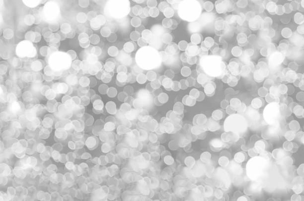 istock Blurred background silver glitter shiny sparkling banner. Happy Holidays background for white template on christmas card brochure. Silver bokeh template for digital presentation slideshow background 1433583868