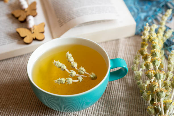 Tea in a turquoise cup with decoration - Greek mountain tea, herbal tea, white tea