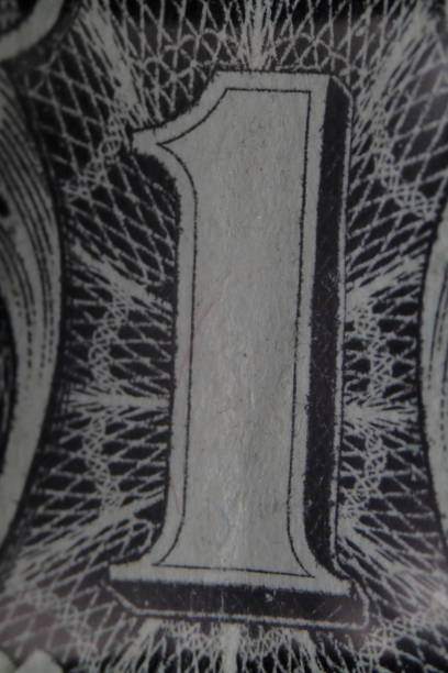 istock One dollar bill detail close up, number one 1433585455
