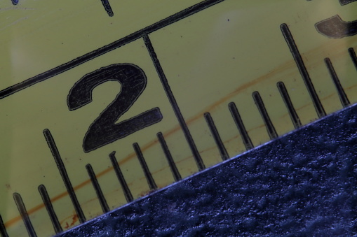 Close-up of the yellow measuring tape indicating the measure two. Number two yellow tape.. High quality photo