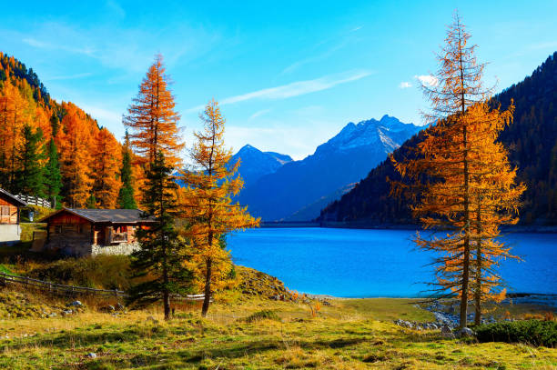 istock Autumn lake Alps hut mountains 1433585870
