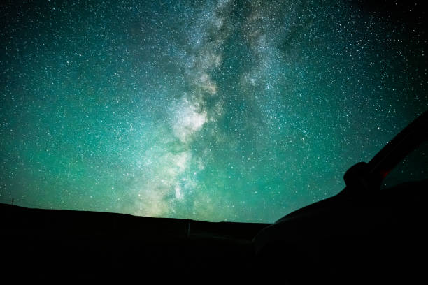 istock Starry sky with car outdoors 1433596114
