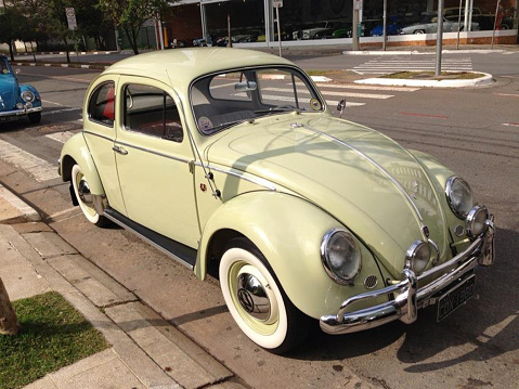 Vintage Volkswagen Beetle , pistachio green ,retro car parked in São Paulo, Brazil, August 2022.