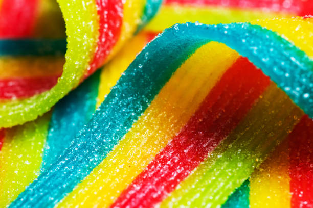 istock Rainbow sour jelly candies strips in sugar sprinkle. 1433603573