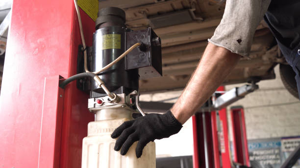istock auto mechanic raises the car on a lift. diagnostics. car workshop 1433606163