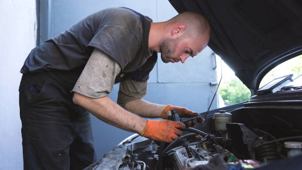 istock auto mechanic repairs car engine. car service. close-up. 1433606225