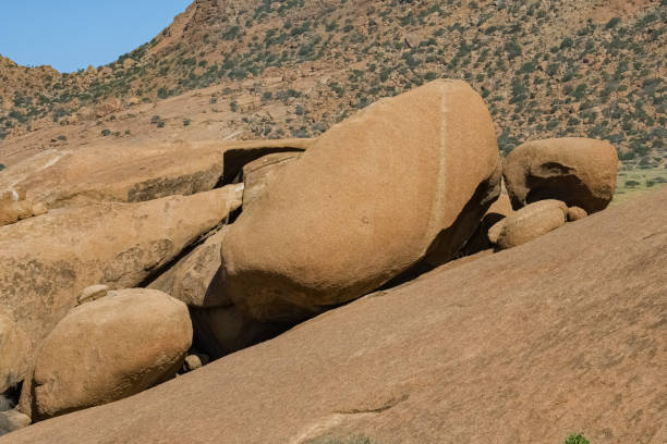 Stone hill seen from below. Blue sky, no people. Damaraland, Namibia. Africa