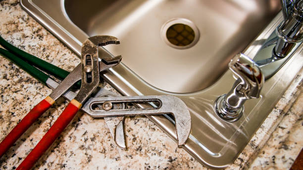 istock New kitchen sink with pipe wrench key on top 1433609982