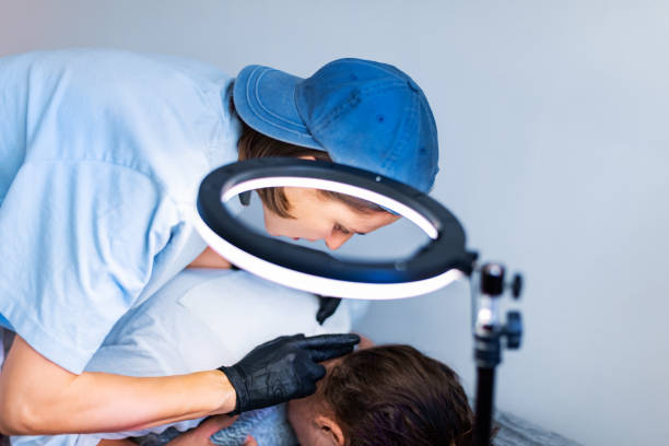 istock Tattoo master tattooing woman's neck 1433613394