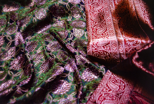 crumpled thai silk fabric textured background. artistic variety shade tone colors ornaments patterns of traditional cultural thai textiles with decorative ornaments crafts by local people