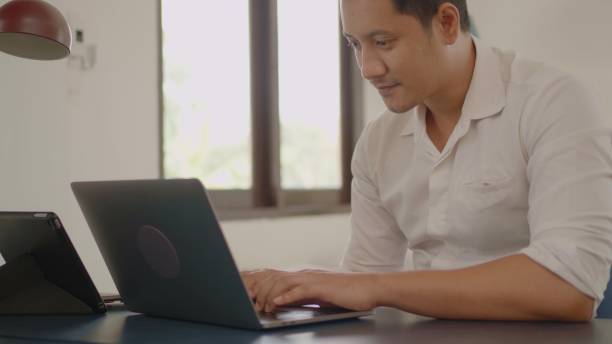 istock Asian man working at home. 1433615990