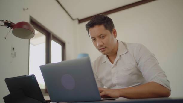 istock Asian man working at home. 1433615992