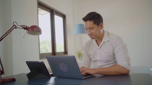 istock Asian man working at home. 1433616056