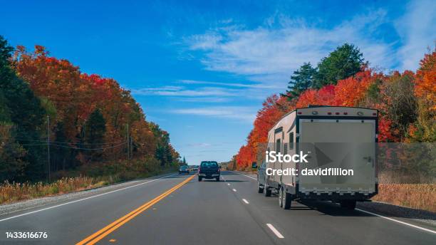 Rv Trailer On A Highway Going Through Autumn Landscape Stock Photo - Download Image Now