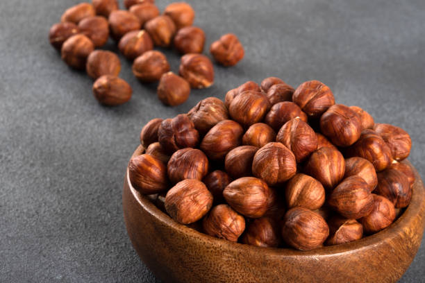 istock Bowl full of hazelnuts  on dark background 1433617483
