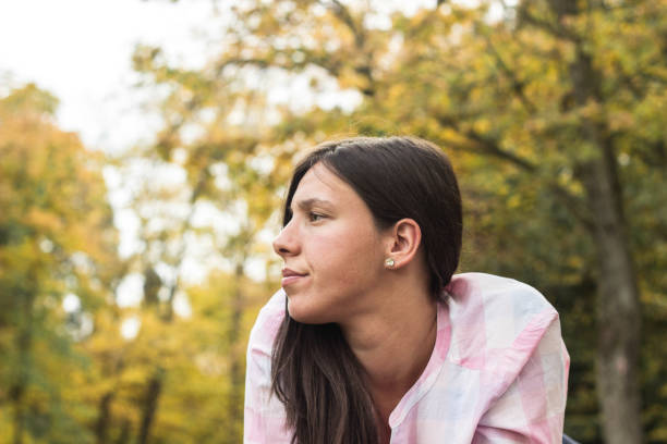 istock Young woman in a autumn park 1433619081