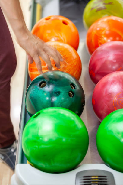 istock Paths with balls and pins for bowling. A fun game for the company 1433619180
