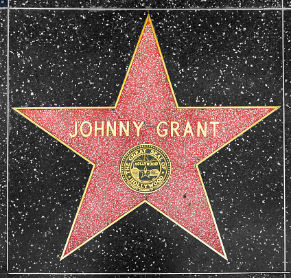 Los Angeles, USA - March 5, 2019: closeup of Star on the Hollywood Walk of Fame for Johnny Grant.