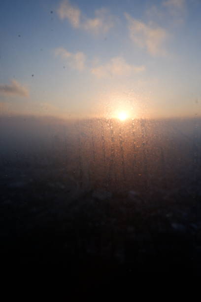 istock abstract view of sun rising behind glass 1433622066