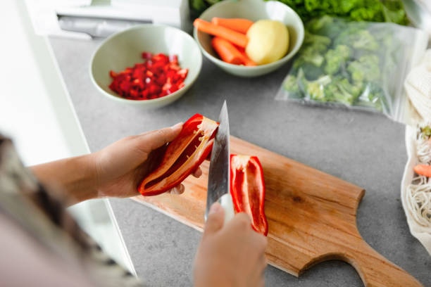 istock Woman preparing pepper for freezing on kitchen 1433624570