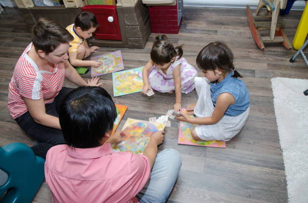 istock Mixed race family playing generic board game 1433625649