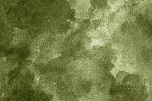 Light olive green abstract watercolor. Art background with space for design. Daub, stain.