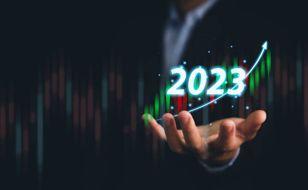 istock businessman plots a powerful analytical strategy that shows a positive digital technology chart. Stock growth development ideas, investment, stock market, economy, and business success goals in 2023. 1433630990