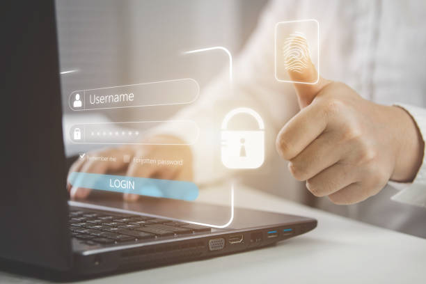 istock Businessmen login to computers by scanning fingerprints to encrypt their virtual personal protection passwords. 1433632279