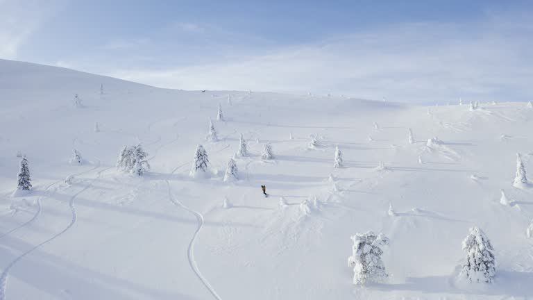 Person snowboarding downhill