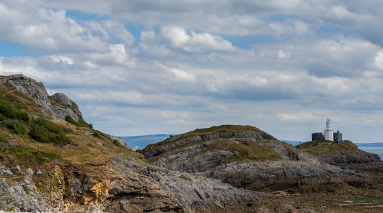panorama view of the Mumbles headland with the historic lighthouse in Swansea Bay
