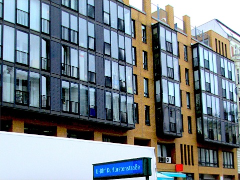 Berlin Winter Street Apartments Geometric Windows with a U-Bahn Subway Station Blue Sign