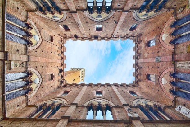 The courtyard of Palazzo Pubblico and Torre del Mangia in Siena, Tuscany, Italy
