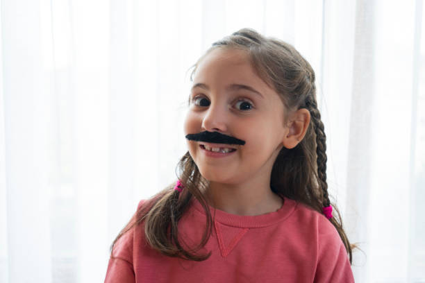 istock Mustached Little Girl 1433640197