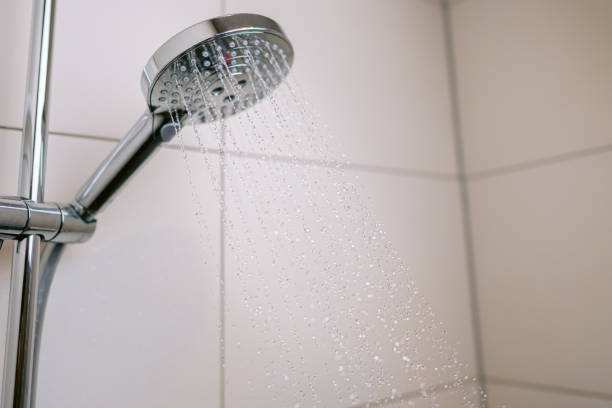 istock Save water when showering with a water-saving shower head 1433641335