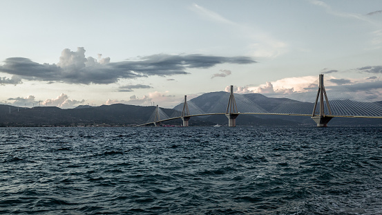 Rion-Antirion Bridge near Patra town at Peloponnese in Greece. Cable-stayed road bridge with pedestrian sidewalks over the Gulf of Corinth.