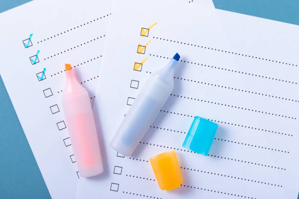 istock Check list with blue and orange marked points and markers on blue background 1433641644