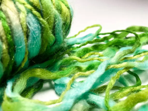 Close up Green handspun yarn art on white background