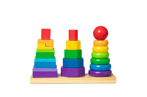 Wooden pyramid children's toy on a white background