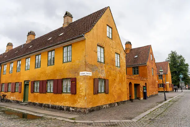 Photo of Beautiful view of the Old orange houses in the famous Nyboder district. Copenhagen. Denmark