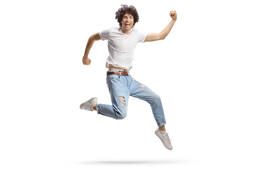 Full length photo of cool excited guy wear striped t-shirt jumping high pointing thumbs himself isolated green color background.