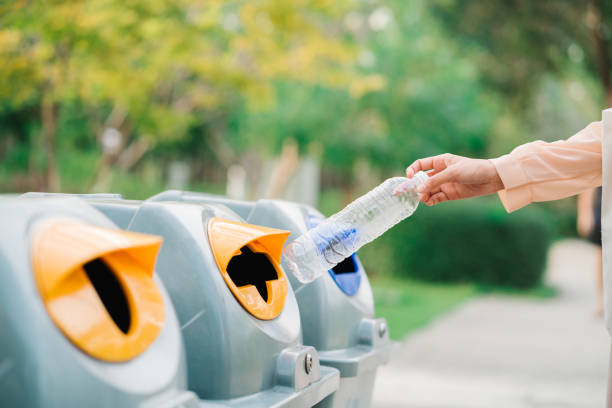istock Woman Hand putting plastic bottle into plastic containers. Waste management 1433648837